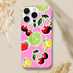 Pink iPhone case featuring cherry, lime, and lemon sticker art on a vibrant background. Tough, shock-absorbing protective cover.