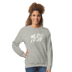 Woman wearing the gray Cute Wild And Free sweatshirt with a white 'Wild and Free' slogan.