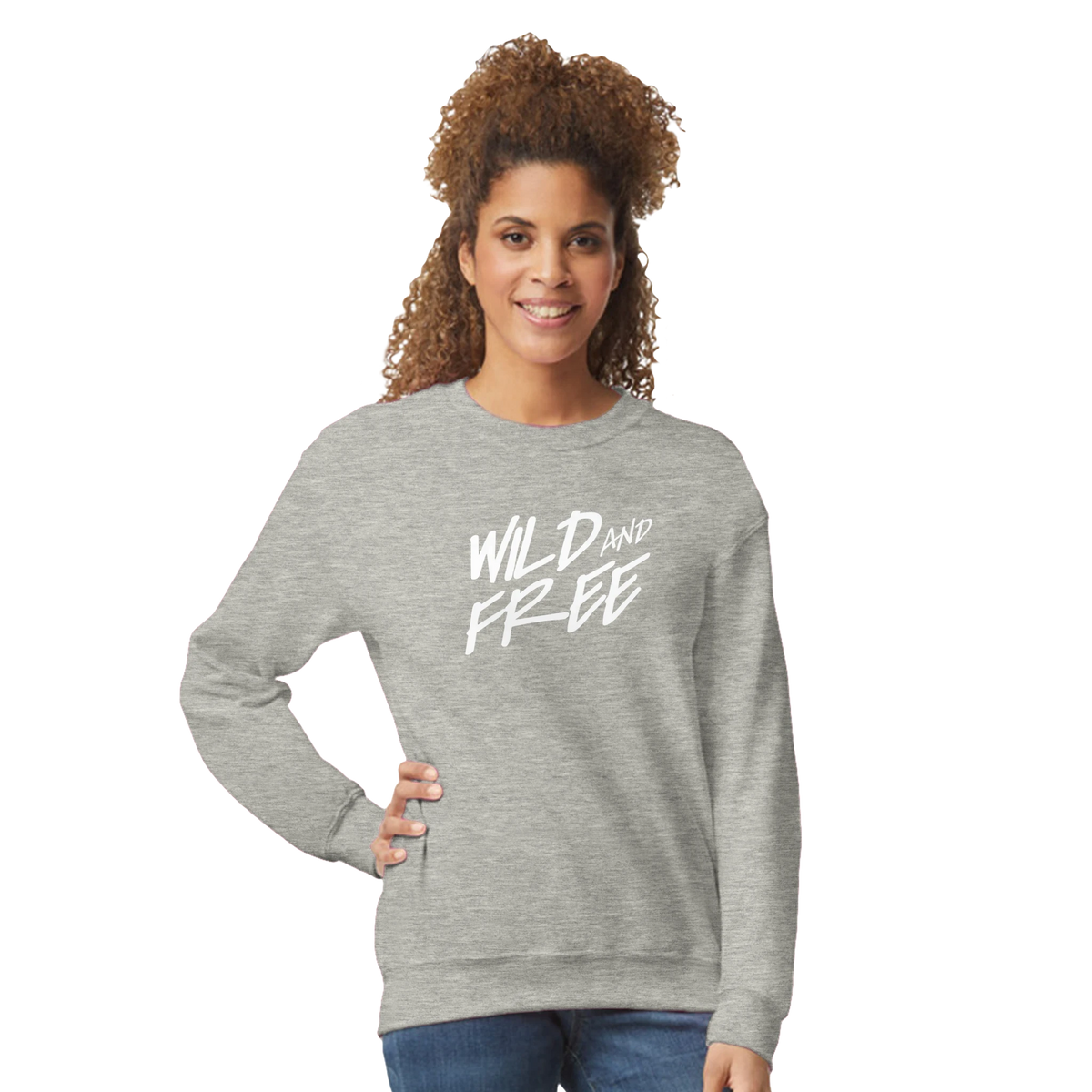 Woman wearing the gray Cute Wild And Free sweatshirt with a white 'Wild and Free' slogan.