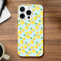 Cute lemon pattern iPhone case featuring fresh yellow fruit and green leaves on a light blue background, designed for iPhone 13-16 models.