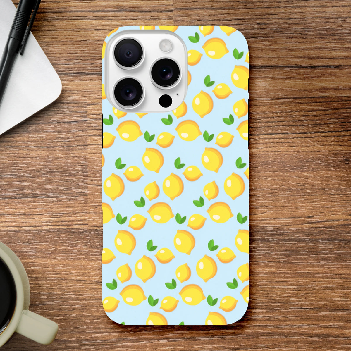 Cute lemon pattern iPhone case featuring fresh yellow fruit and green leaves on a light blue background, designed for iPhone 13-16 models.
