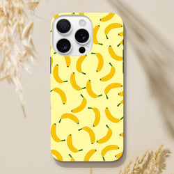 Yellow banana pattern iPhone case featuring scattered fruit illustrations on a pale background for playful protection.