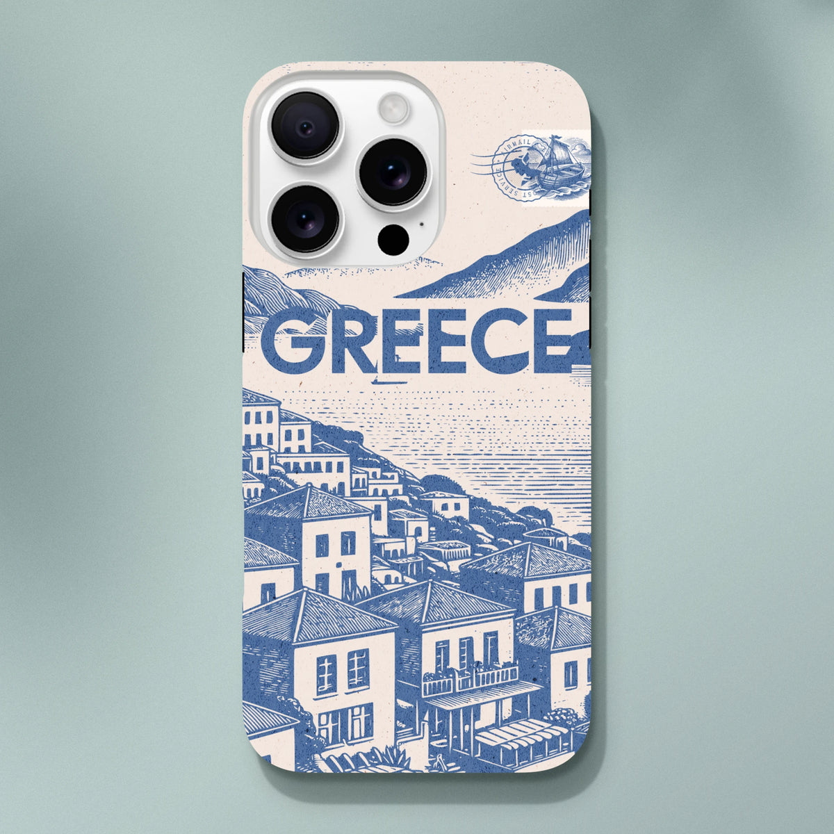 Vintage Greece iPhone case featuring a blue Mediterranean coastal village illustration, bold GREECE text, and a vintage airmail stamp design.