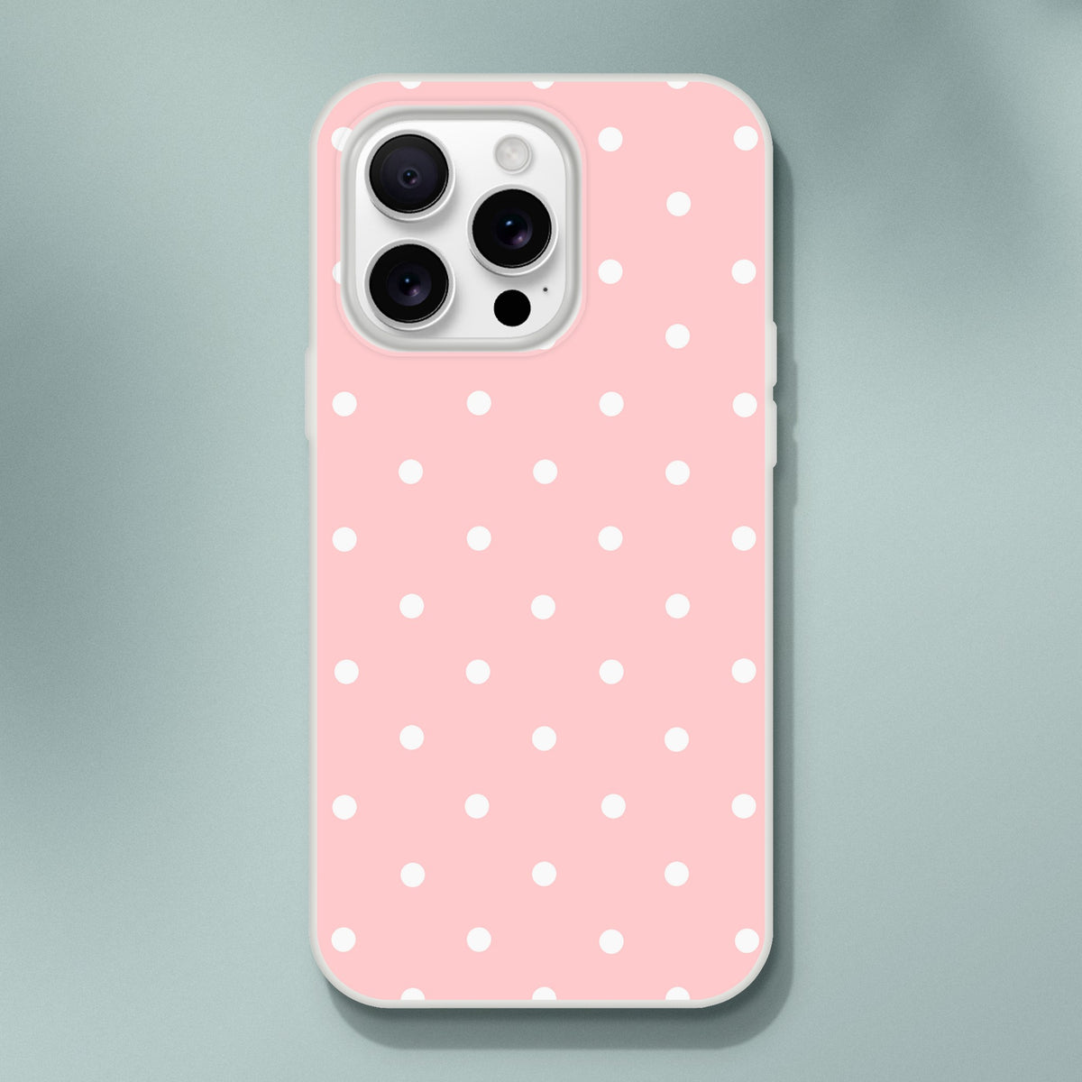 Pastel pink retro iPhone case with white polka dots, featuring a matte finish and shock-absorbing TPU protection for daily use.