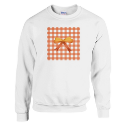 White pullover sweatshirt featuring an orange gingham square design with a 3D orange bow, capturing a cute coquette aesthetic.