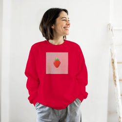 Red crewneck sweatshirt featuring a retro gingham square graphic with a single草莓 illustration on the chest.