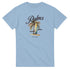 Light blue women's tee featuring a palm tree, surfboard graphic, Palms script, and EST. 1985.
