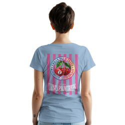 Back of light blue women's t-shirt featuring a large retro graphic of red cherries on pink vertical stripes with Urban Palm Trees text.