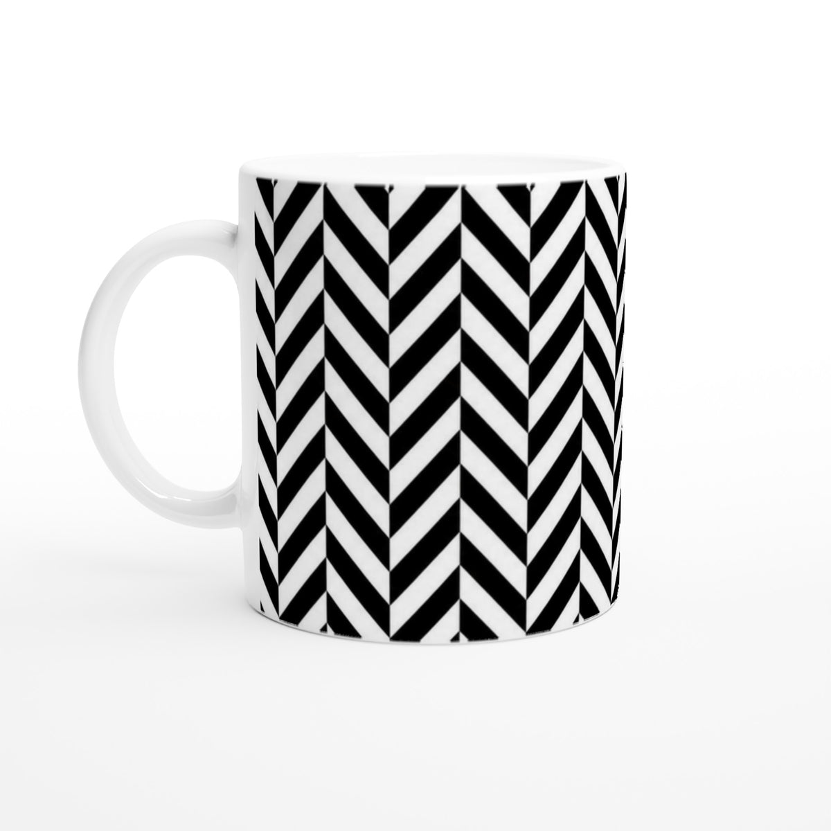 Black and white ceramic coffee mug featuring a bold geometric herringbone chevron pattern for home or office use.