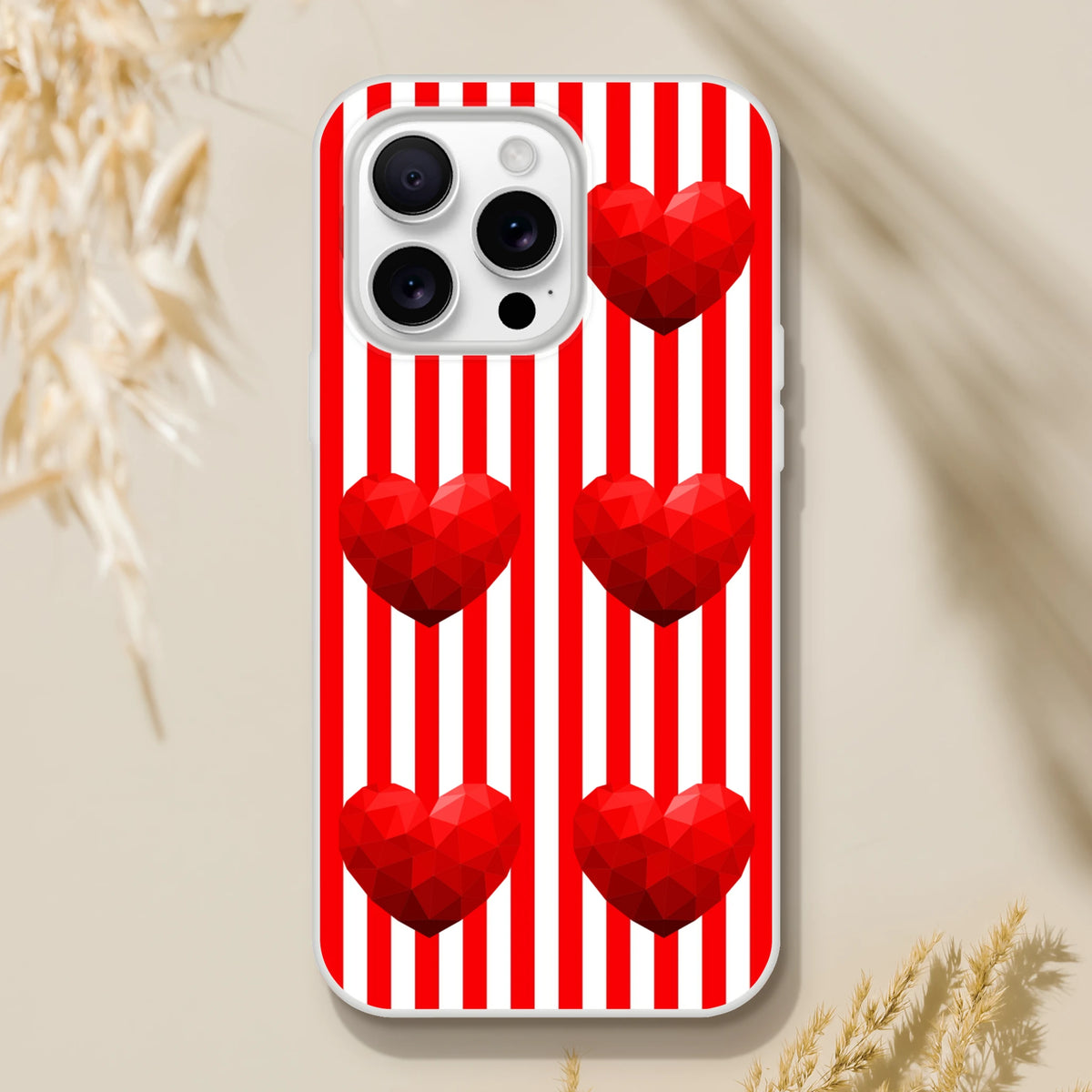 Red-striped iPhone case with geometric hearts for iPhone 13-16, bold romantic aesthetic.