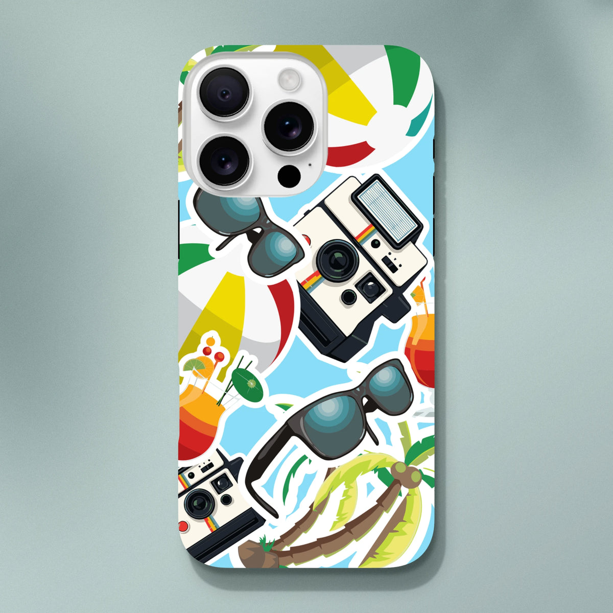 Vibrant summer holiday sticker effect iPhone case featuring palm trees, vintage cameras, sunglasses, and cocktails on a blue background.