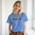 Young woman wearing a blue Believe In Yourself T-shirt with retro slogan.