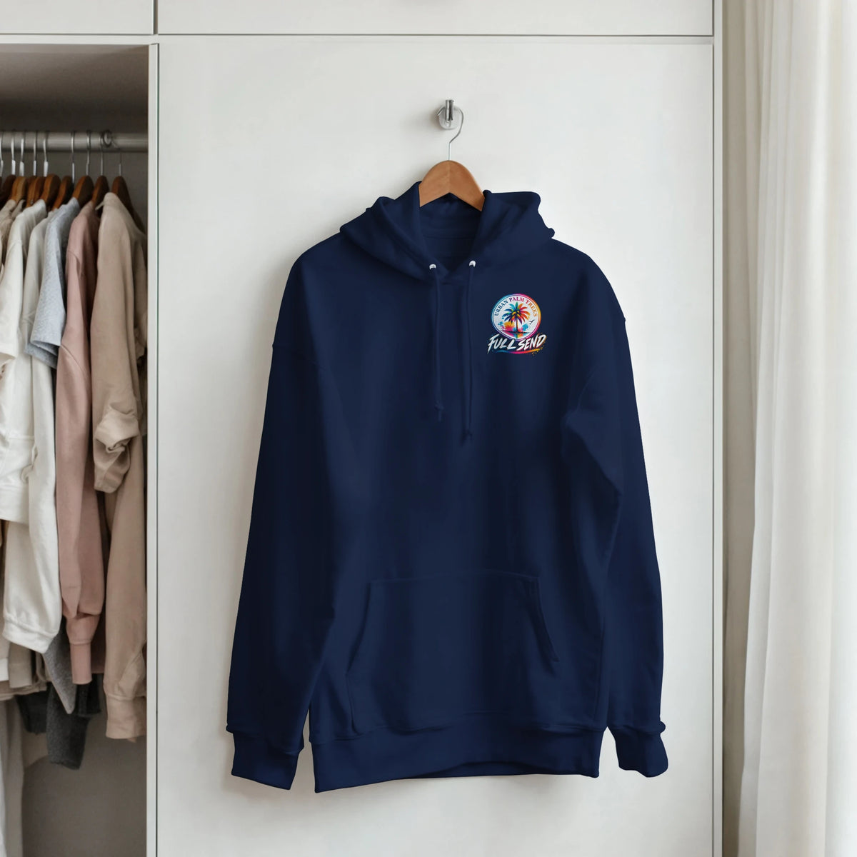 Navy blue Fitment Petrolhead hoodie featuring a colorful "Full Send" palm tree graphic on the chest, hanging on a wooden hanger.
