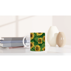 Vintage Sunflower Mug with bright sunflower pattern and white handle, a cute floral coffee cup on a desk.