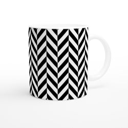 Black and white herringbone ceramic coffee mug featuring a bold geometric chevron pattern design.