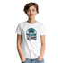 Woman wearing white tropical beach graphic T-shirt with circular palm-tree sunset and Summer Beach design.