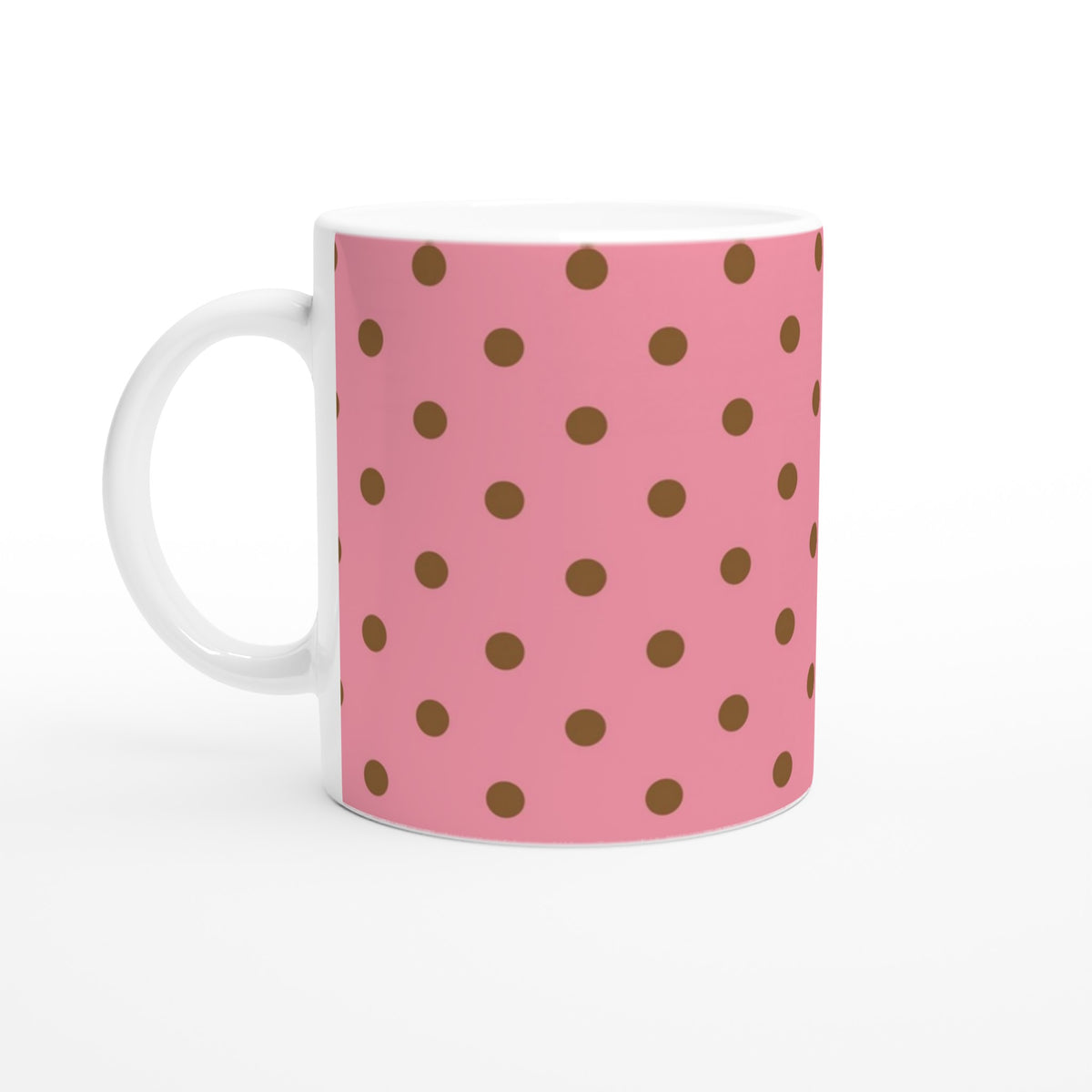 Pink ceramic mug featuring retro brown polka dots. 11oz coffee cup for home, office, or gifting.