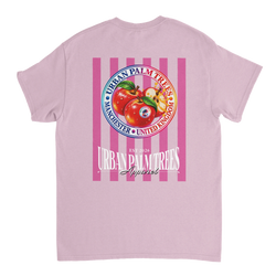 Back of pink women's graphic tee featuring retro red apples and vertical stripes with Urban Palm Trees Manchester text print.