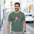 Man wearing a green Gothic Angel graphic T-shirt with guardian angel artwork on a city street.