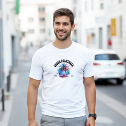Man wearing white Urban Palm Trees T-Shirt with colorful palm tree graphic, retro streetwear style.