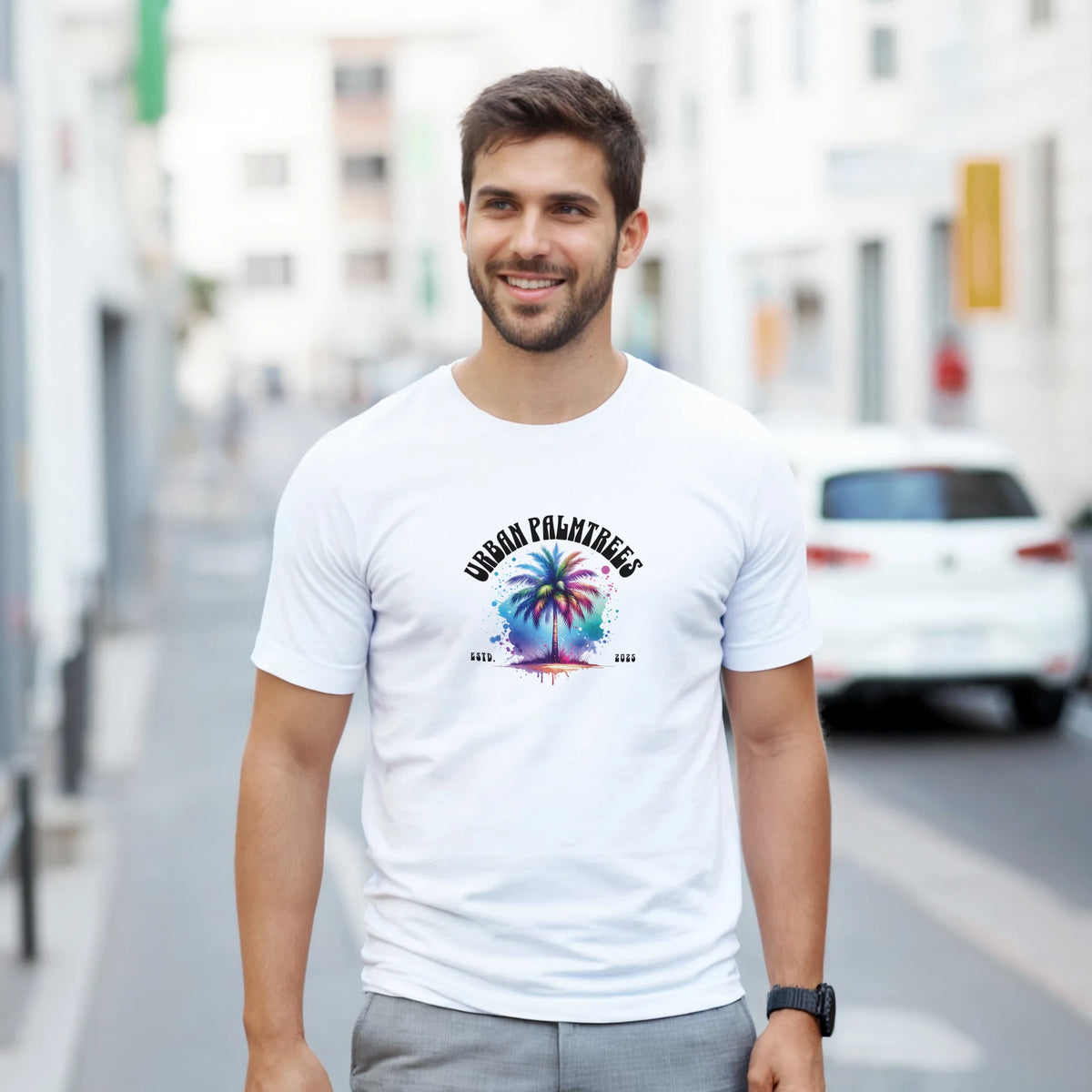 Man wearing white Urban Palm Trees T-Shirt with colorful palm tree graphic, retro streetwear style.