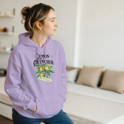 Woman in lavender Lemon Quencher graphic hoodie with lemon plant design.