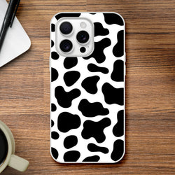 Black and white cow print iPhone case for 13-16, bold Y2K animal design.