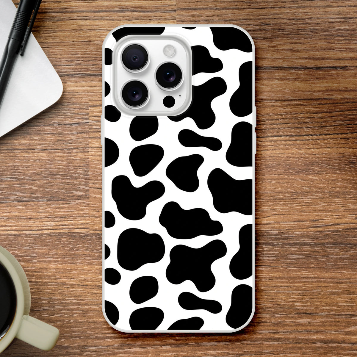 Black and white cow print iPhone case for 13-16, bold Y2K animal design.