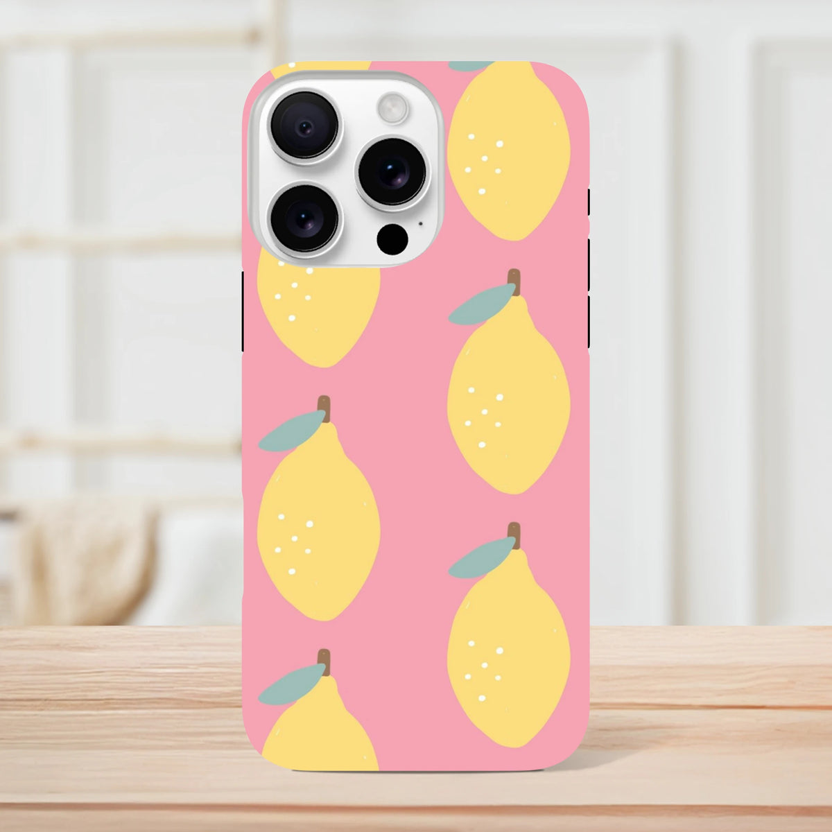 Pink lemon tough iPhone case featuring a cute yellow lemon pattern on a pink background, offering stylish protection for urban use.