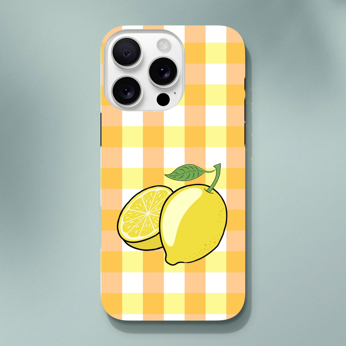 Yellow gingham iPhone case featuring a whole lemon and slice illustration with drop protection for iPhone 13-16.