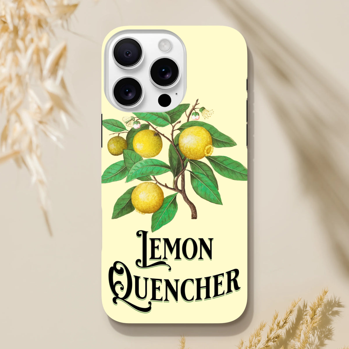 Vintage lemon tough iPhone case featuring retro botanical fruit illustration and "Lemon Quencher" script typography on a pale yellow background.
