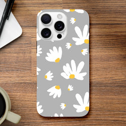 Grey protective iPhone case featuring a white daisy floral pattern with yellow centers on a utilitarian grey background.