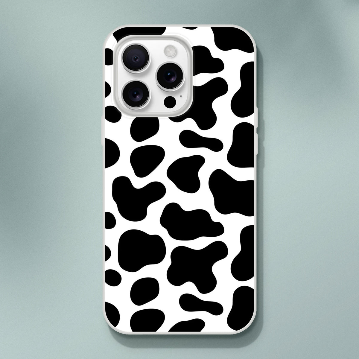 Black and white cow-print iPhone case for iPhone 13-16 with bold Y2K animal style.