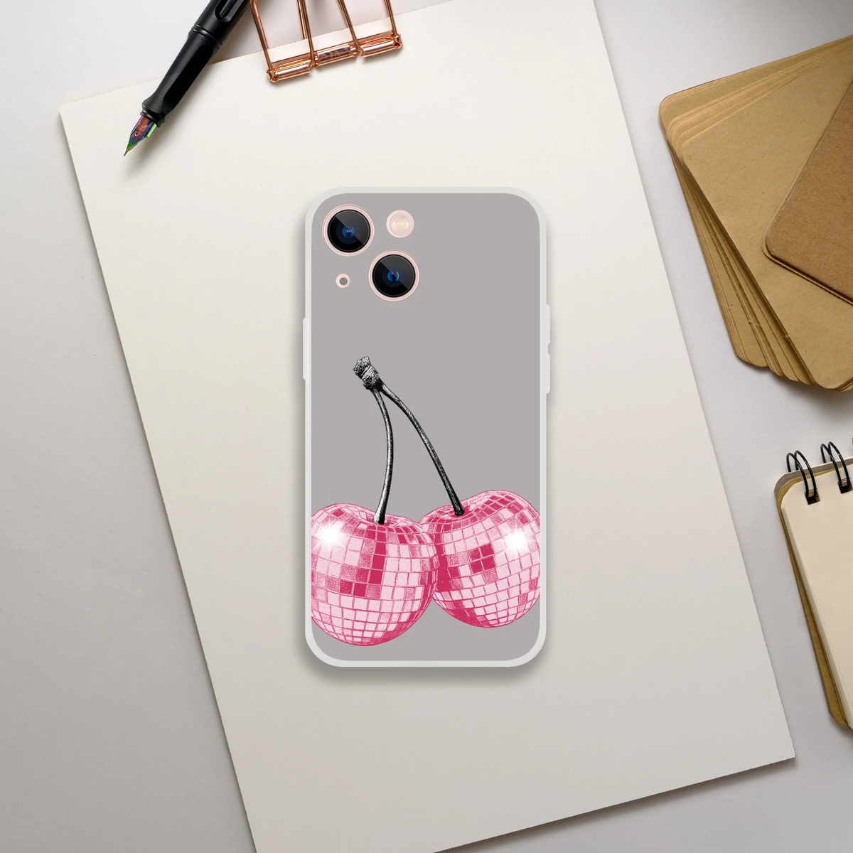 Y2K glitter cherries iPhone case (13-16) retro aesthetic gray shell with black stems and pink glitter cherries on desk