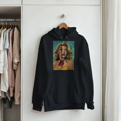 Black pullover hoodie featuring a retro pop art graphic of a blonde pin-up woman with a red bandana hanging on a wooden hanger.