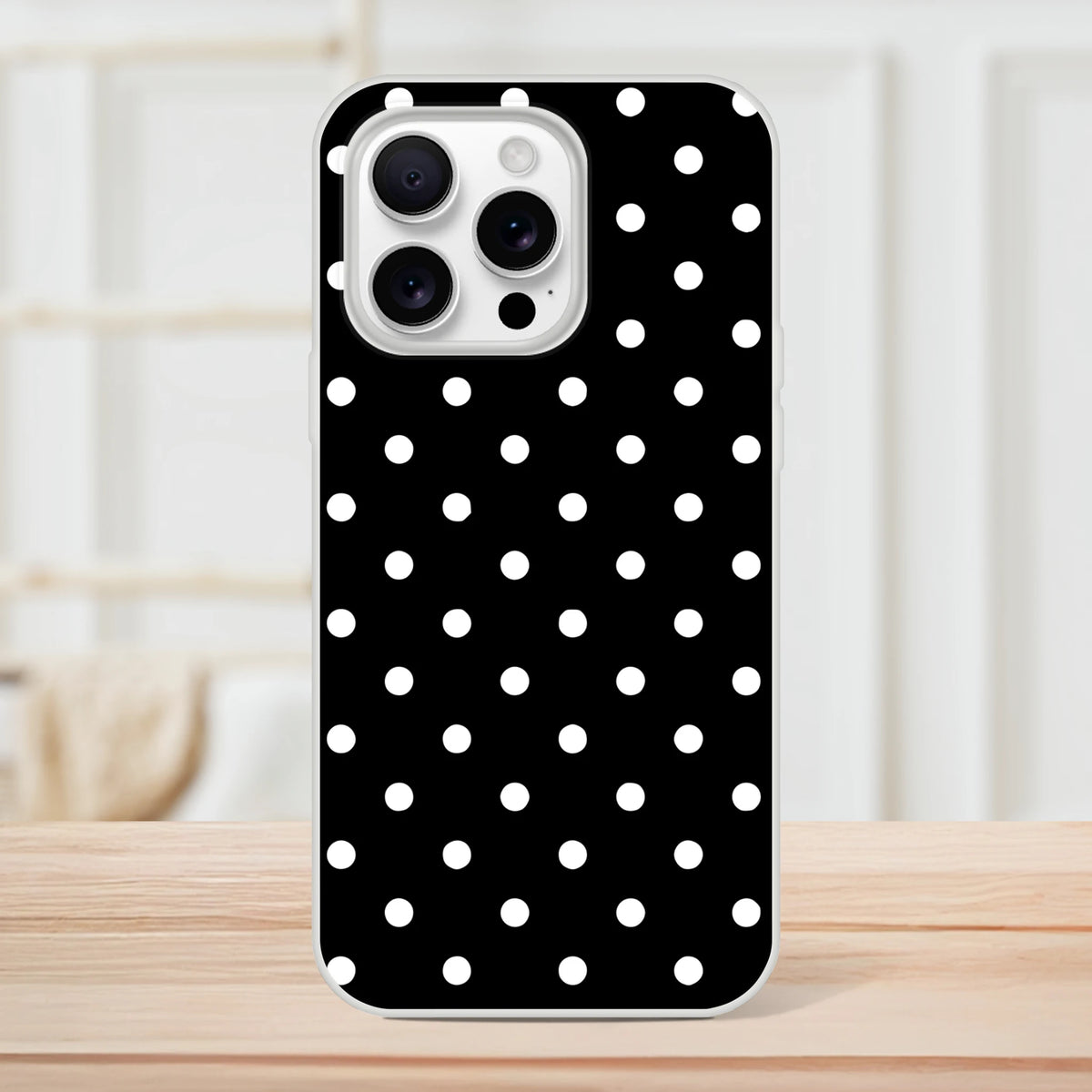 Retro black and white polka dot iPhone case featuring a slim matte finish and precise camera cutout for drop protection.