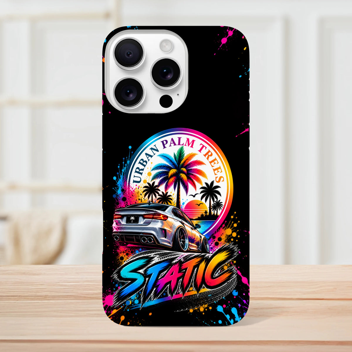 Vibrant iPhone case featuring a slammed silver car, rainbow palm trees, and colorful Static lettering against a black background.