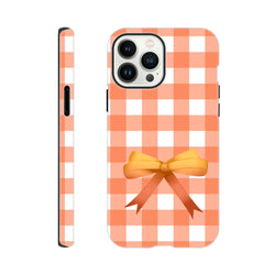 Orange gingham bow iPhone case with impact-resistant coquette design for daily commute protection.