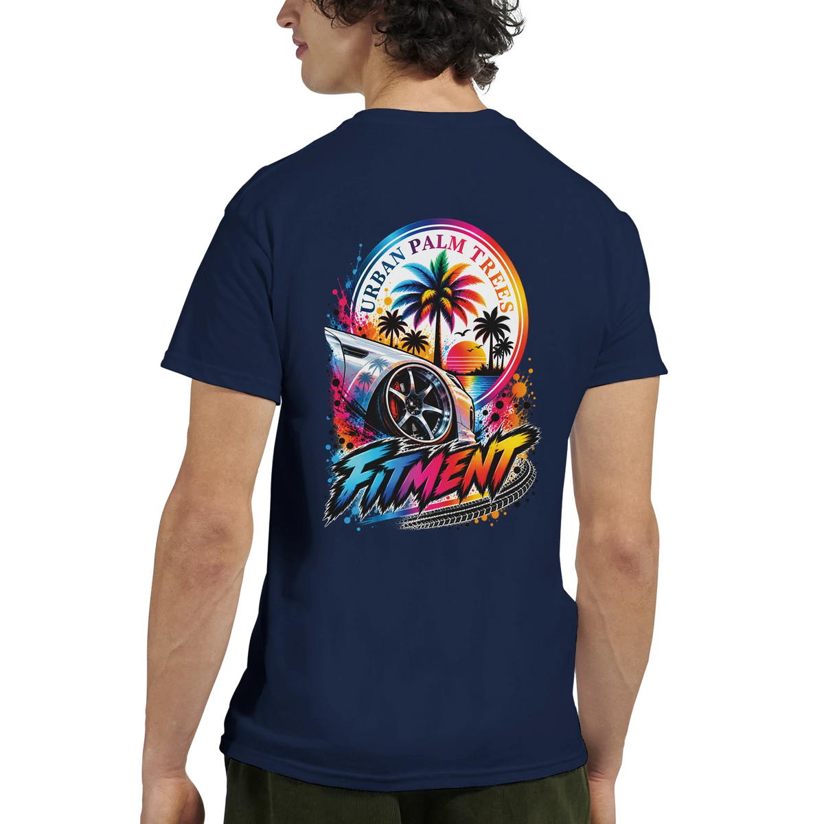 Navy blue men's graphic tee featuring a colorful modified car graphic with palm trees and "Fitment" text on the back.