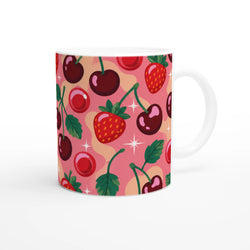 Retro pink ceramic mug featuring a cherry and strawberry pattern with sparkles and green leaves.