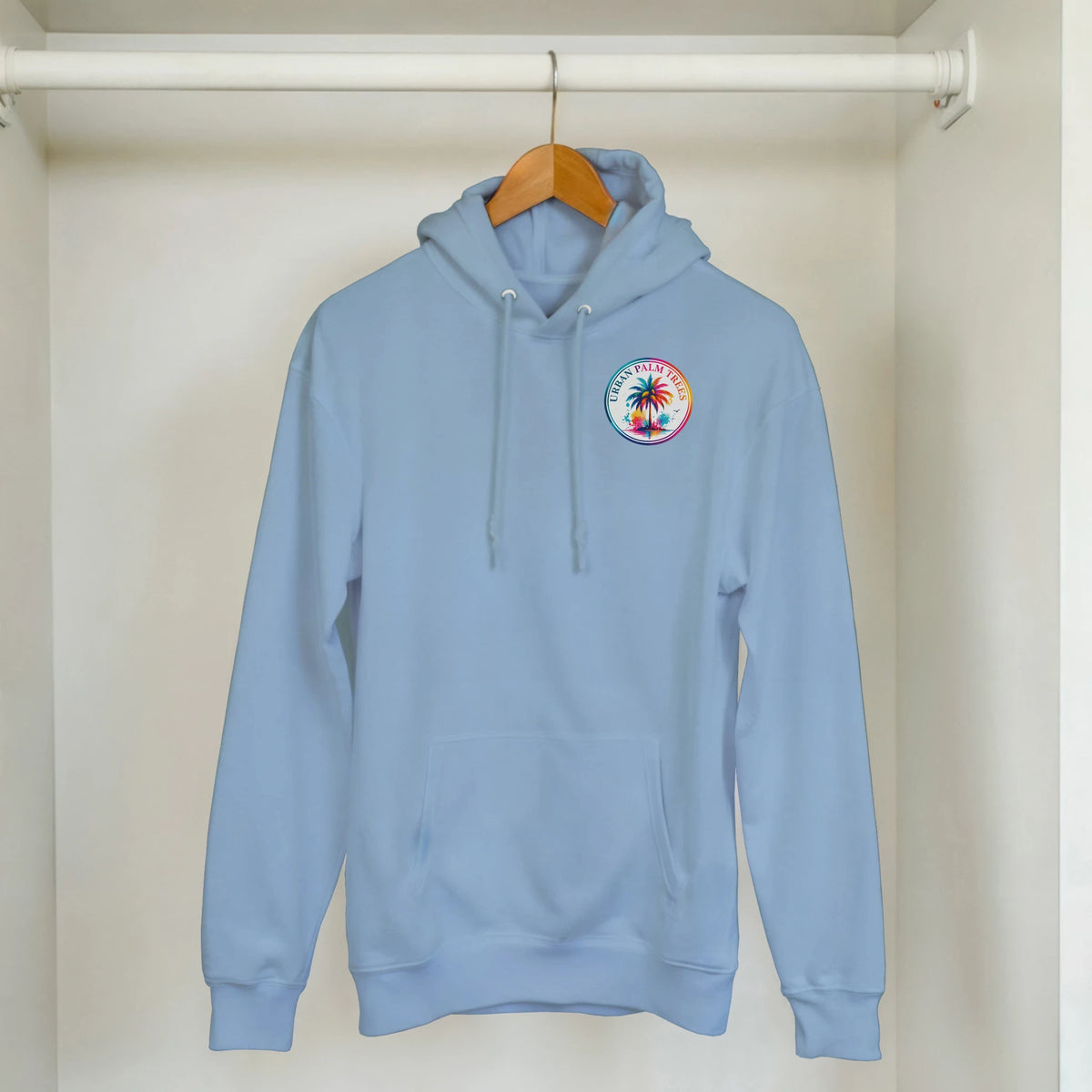 Light blue hoodie featuring a colorful circular tropical palm tree graphic on the chest and a front pouch pocket.