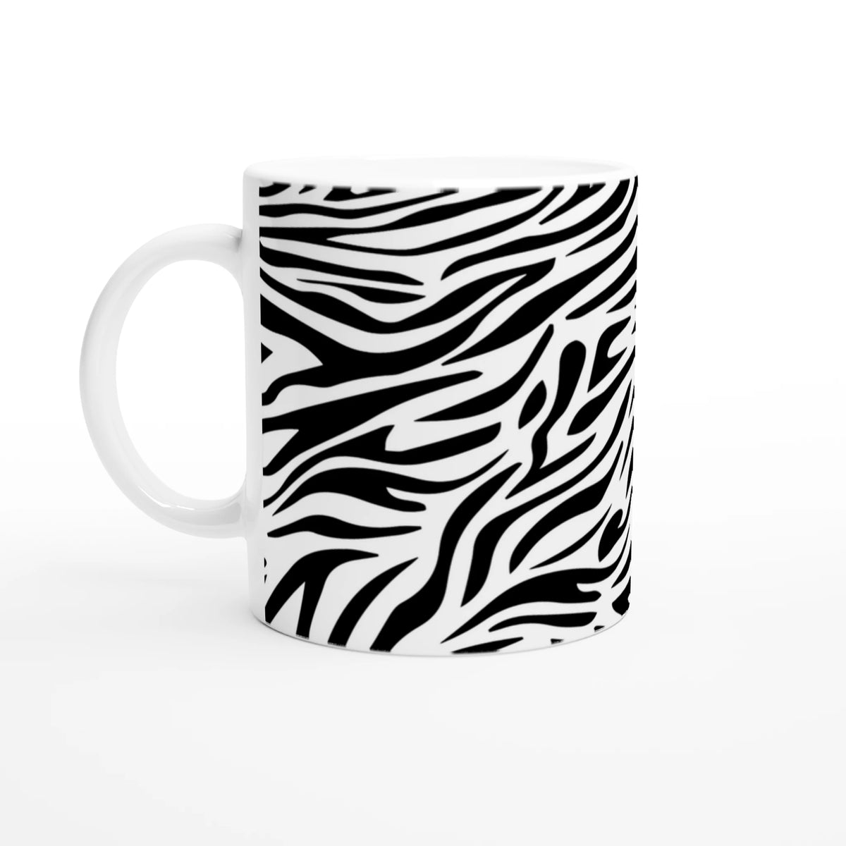 Black and white zebra print mug with bold animal pattern and curved handle.