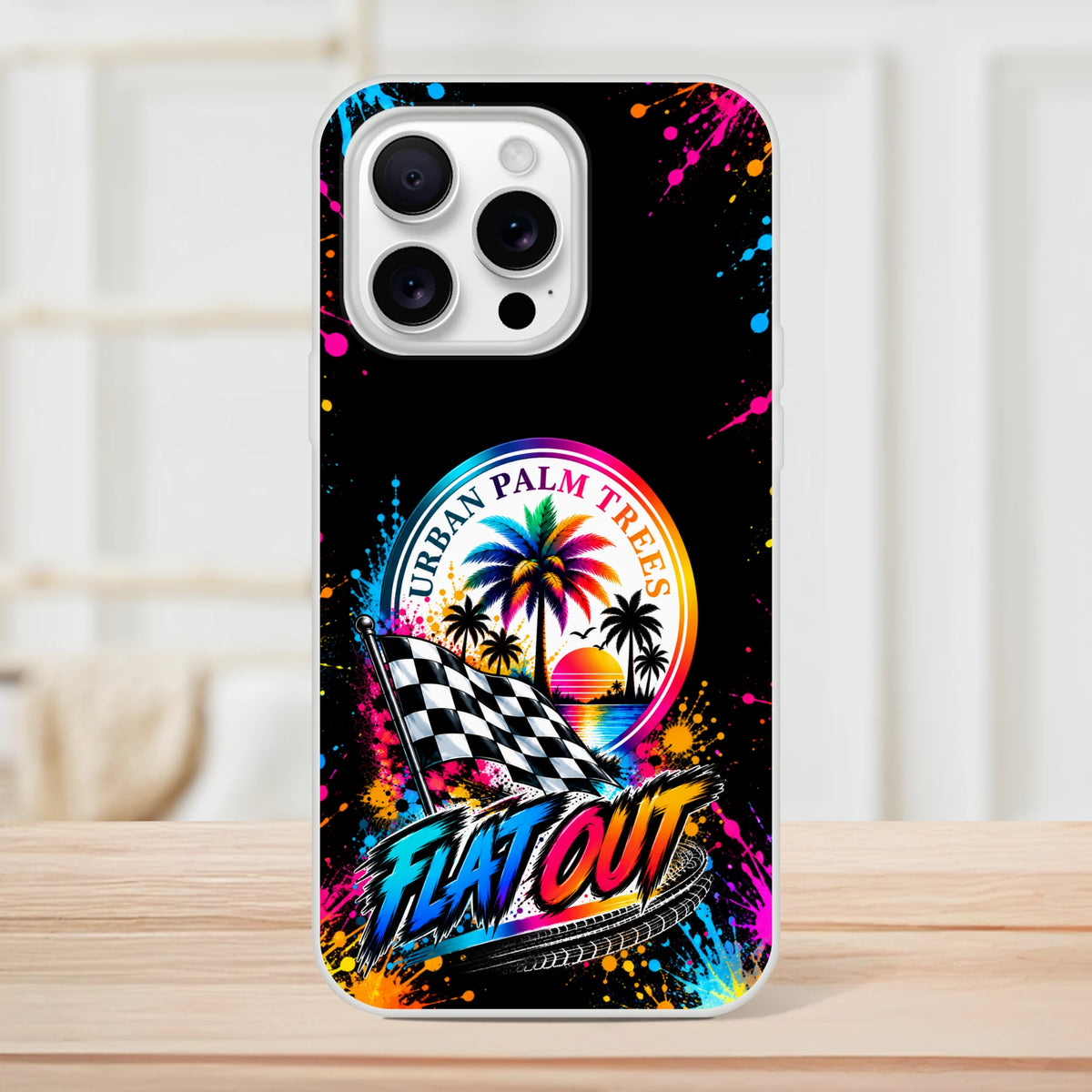 Vibrant Flat Out iPhone case featuring colorful paint splatters, Urban Palm Trees sunset, checkered flag, and bold racetrack typography.