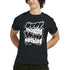 Man wearing black men's mental health graphic T-shirt with white "Over thinking solves nothing" slogan.