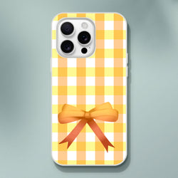 Yellow gingham bow iPhone case for 13-15, cute coquette aesthetic with a bright yellow bow.