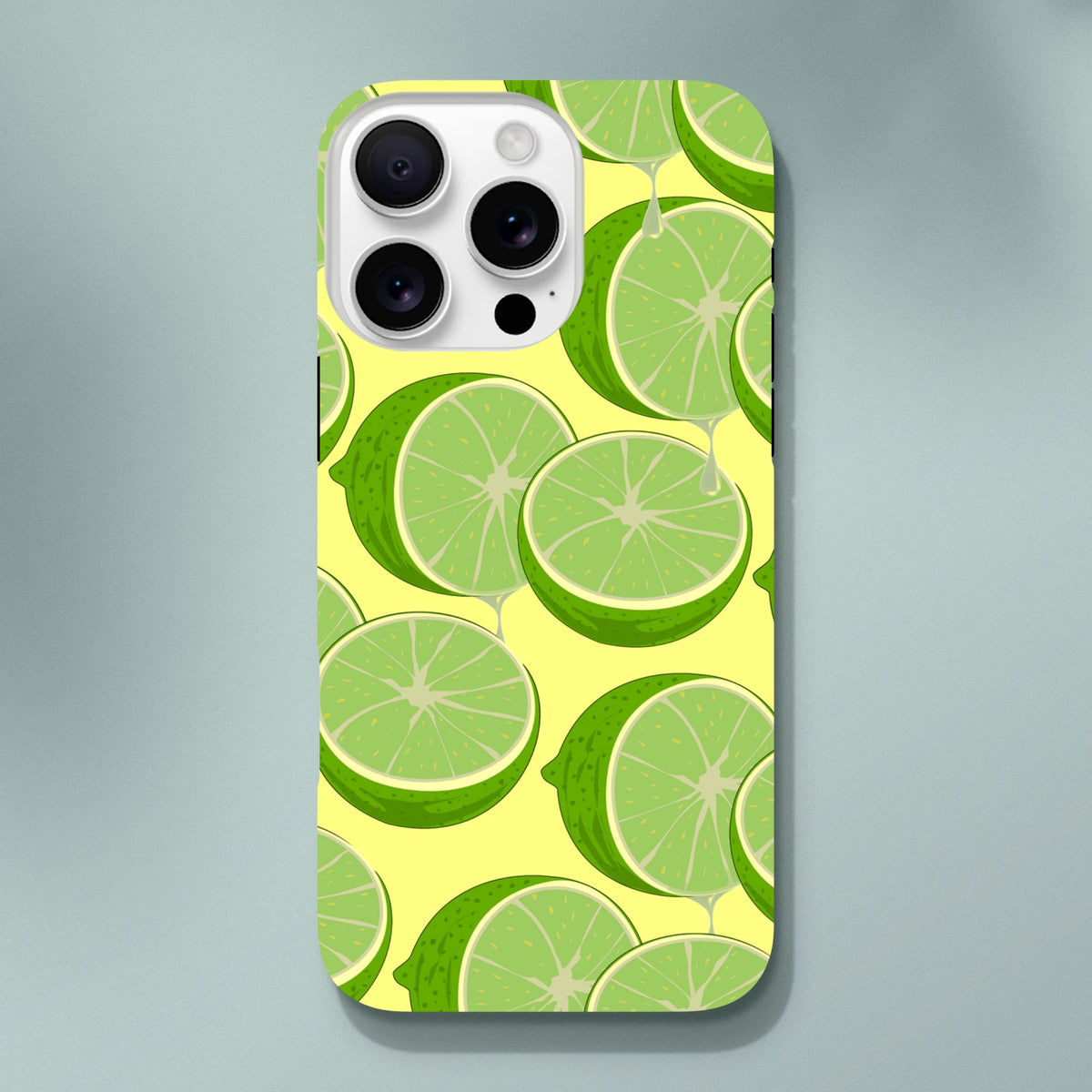 Fresh green lime slices on yellow durable iPhone case. Citrus graphic streetwear phone cover protecting devices from daily impacts.