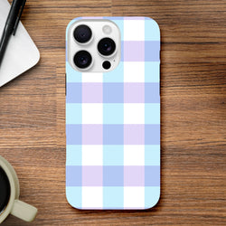 Pastel blue gingham iPhone case with lavender and white checkered pattern, featuring tough shock-absorbing protection for daily use.