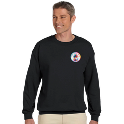Man wearing black crew neck sweatshirt featuring colorful circular Urban Palm Trees graphic on the left chest.
