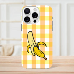 Cute yellow gingham iPhone case featuring a cartoon peeled banana on a checkered background. Tough protective cover for iPhone 13-16.