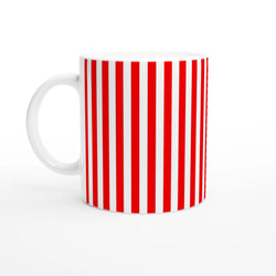 Retro candy cane ceramic mug with bold red vertical stripes on white, handle visible.